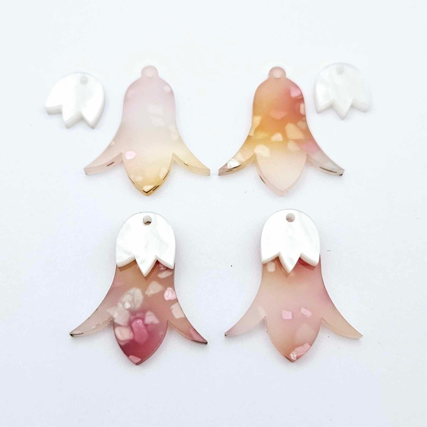 28mm frangipani petal acrylic nodding flower dangle blanks shown on their own and with white marble leaf cap pieces