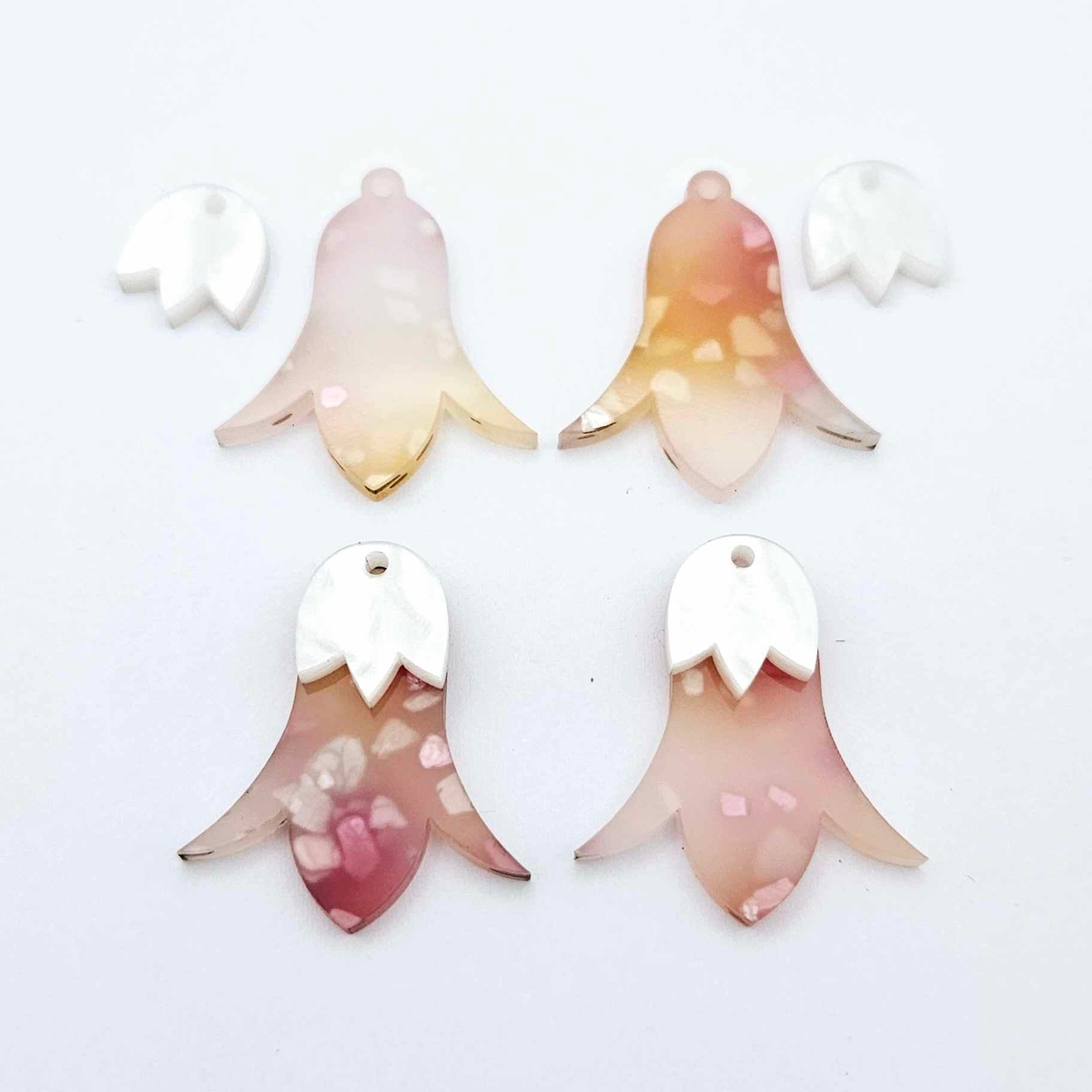 28mm frangipani petal acrylic nodding flower dangle blanks shown on their own and with white marble leaf cap pieces
