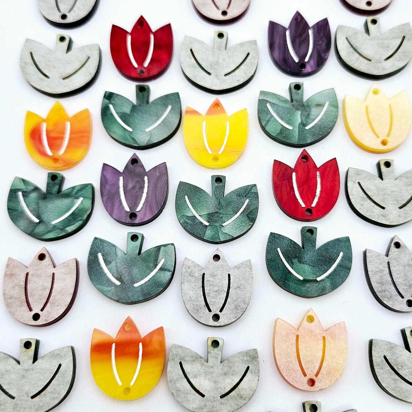 Two-piece tulip acrylic dangle blanks in marble and green mineral acrylic mixed pack, paint filled white on some with remaining unfilled