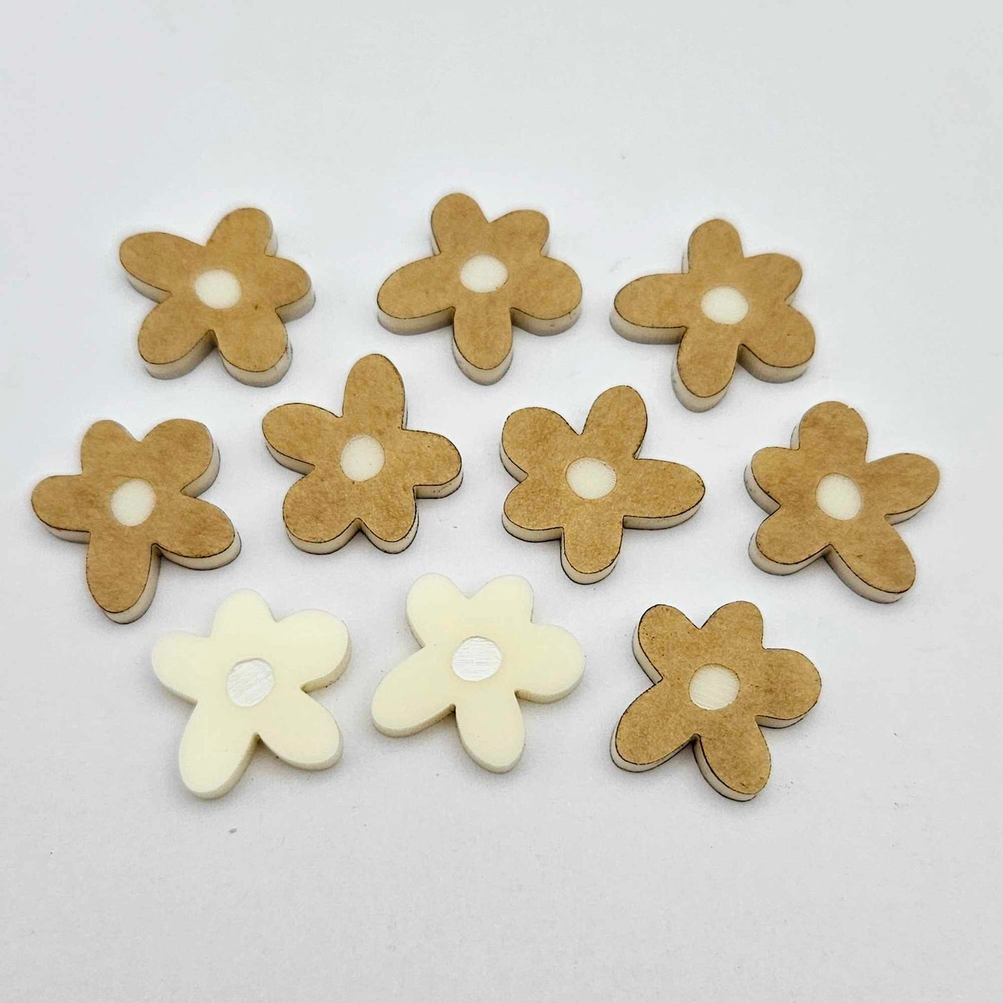 16mm cream organic flower stud blanks with engraved centre, one pair paint filled white and several unfilled pieces shown with protective film on