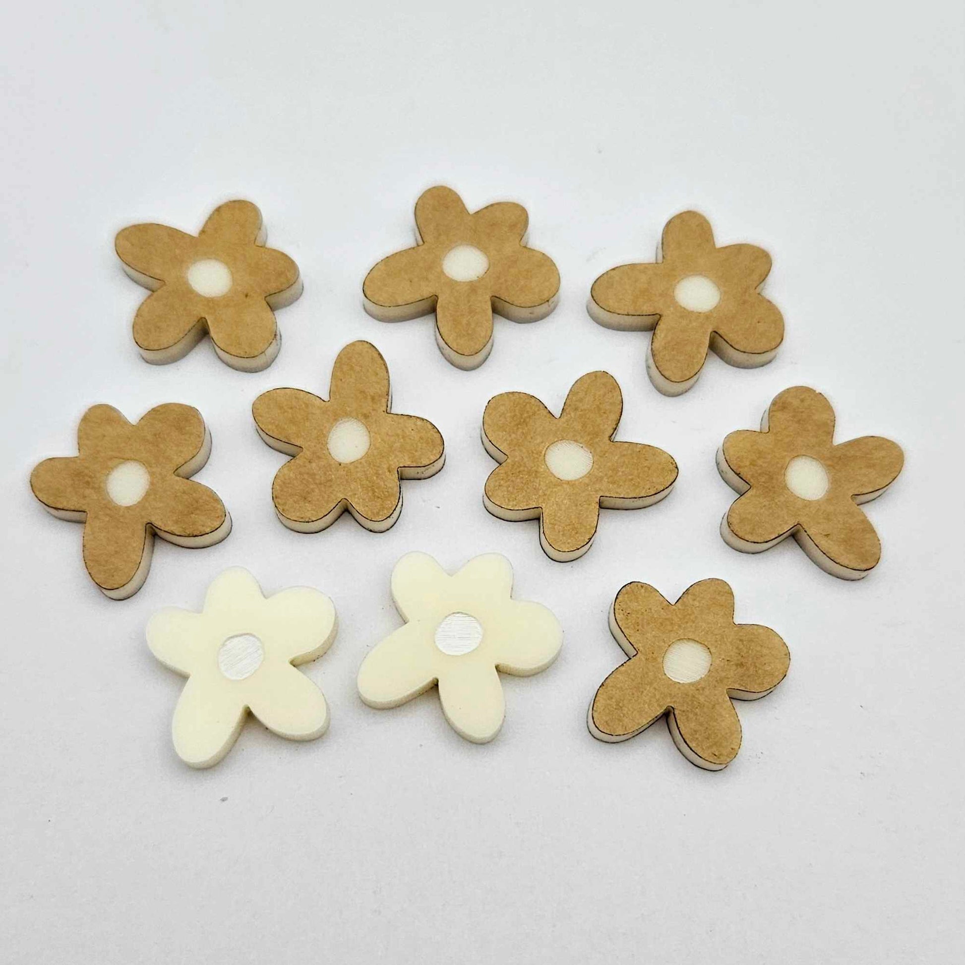 16mm cream organic flower stud blanks with engraved centre, one pair paint filled white and several unfilled pieces shown with protective film on