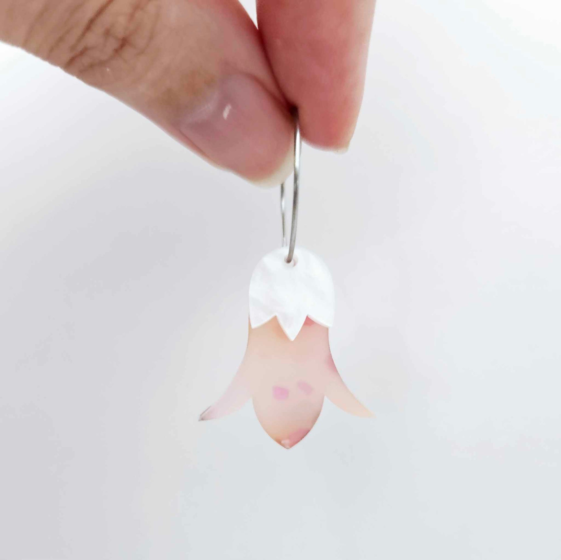 Frangipani petal acrylic nodding flower dangle blanks assembled on 20mm hoops with leaf cap detail for a layered botanical flower look