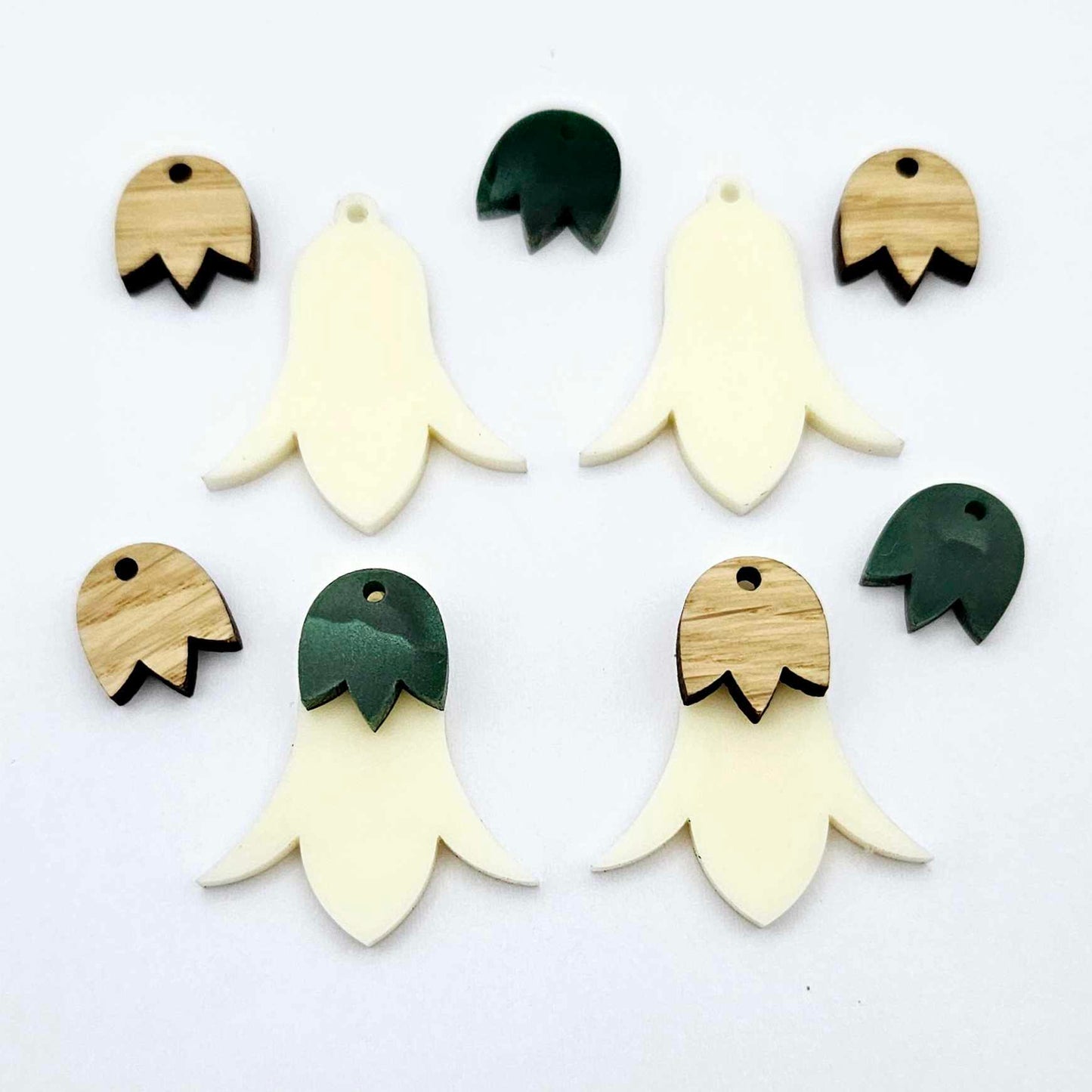 28mm cream acrylic nodding flower dangle blanks shown on their own and with oak wood and green mineral leaf cap pieces