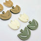 Cream and olive green acrylic tulip dangle blanks, one pair paint filled white and one pair with protective paper on, shown as a two-piece floral design