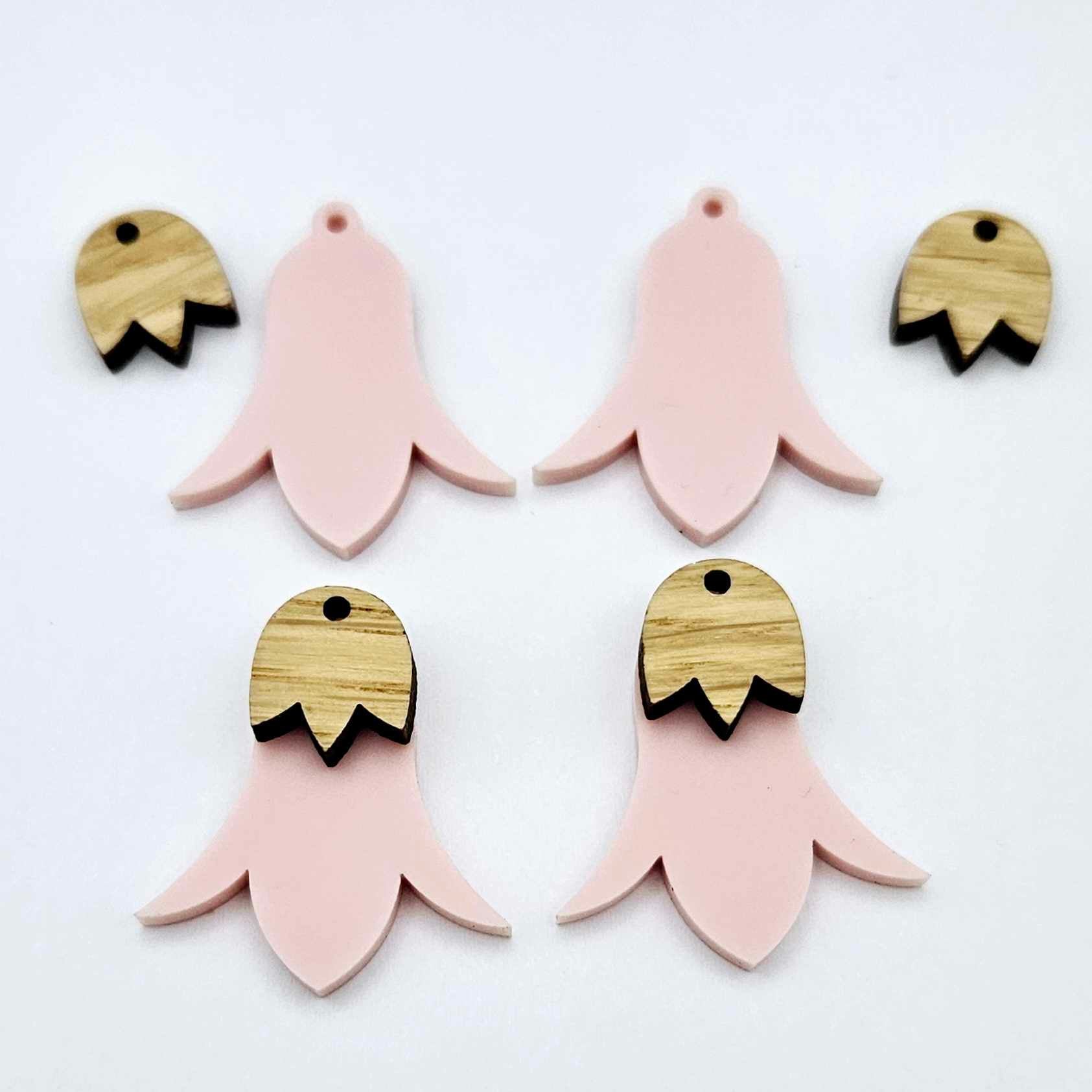 28mm dusty pale pink nodding flower dangle blanks shown on their own and with oak wood leaf cap pieces
