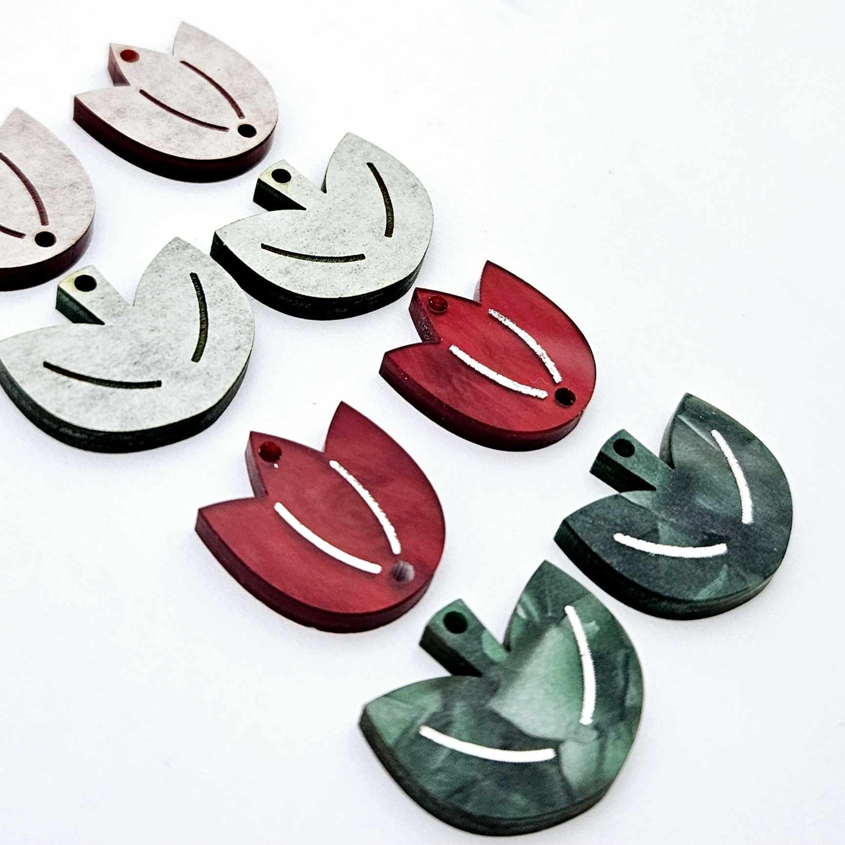 Two-piece tulip acrylic dangle blanks in red marble and green mineral acrylic, paint filled white on one pair with remaining pair unfilled