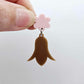 28mm iced coffee brown acrylic nodding flower dangle hanging from a 14mm flower topper, shown as a completed earring design
