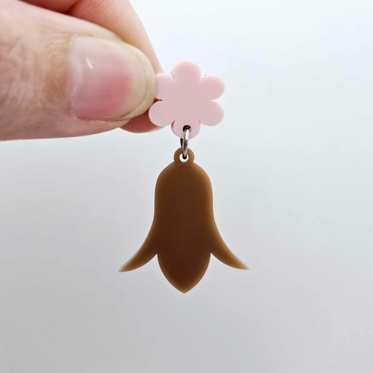 28mm iced coffee brown acrylic nodding flower dangle hanging from a 14mm flower topper, shown as a completed earring design