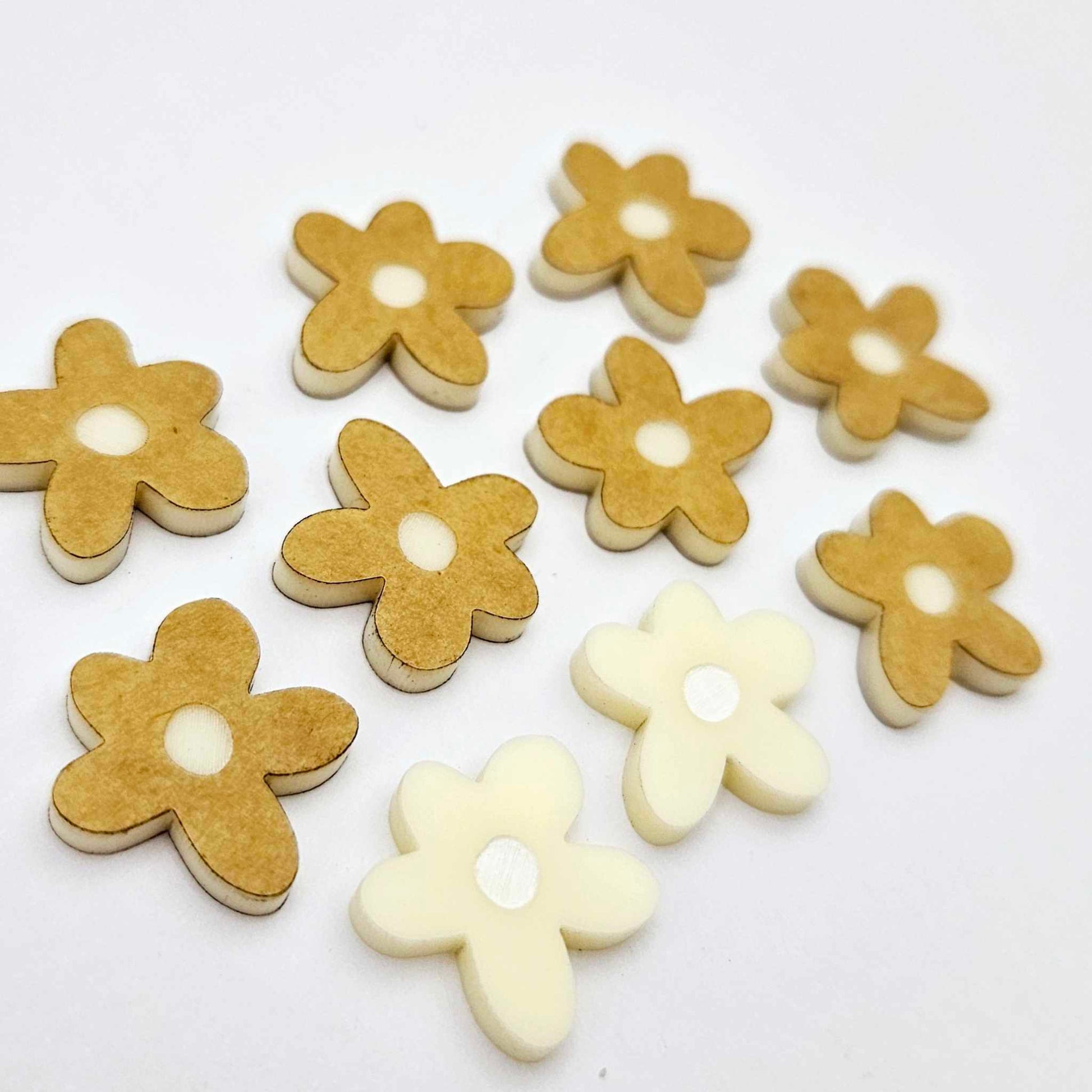 16mm cream organic flower stud blanks with engraved centre, one pair paint filled white and several unfilled pieces shown with protective film on