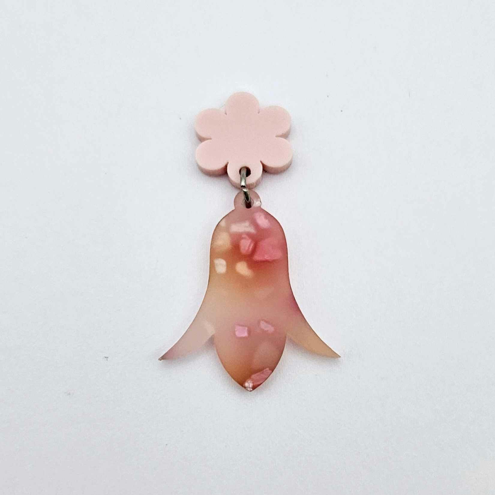 28mm frangipani petal acrylic nodding flower dangle hanging from a 14mm flower topper, shown as a completed earring design