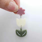Cream and Olive Green acrylic tulip shape earring blanks shown with one of our dusty rose flower toppers
