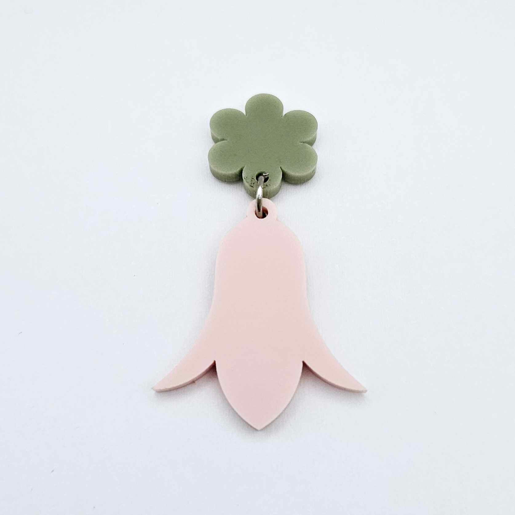 28mm dusty pale pink nodding flower dangle hanging from a 14mm flower topper, shown as a completed earring design
