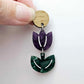 Assembled purple marble and green mineral acrylic tulip dangle hanging from a 14mm oak wood topper, engraved detail paint filled white