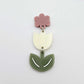 Assembled cream and olive green acrylic tulip dangle hanging from a 14mm flower topper, engraved detail paint filled white
