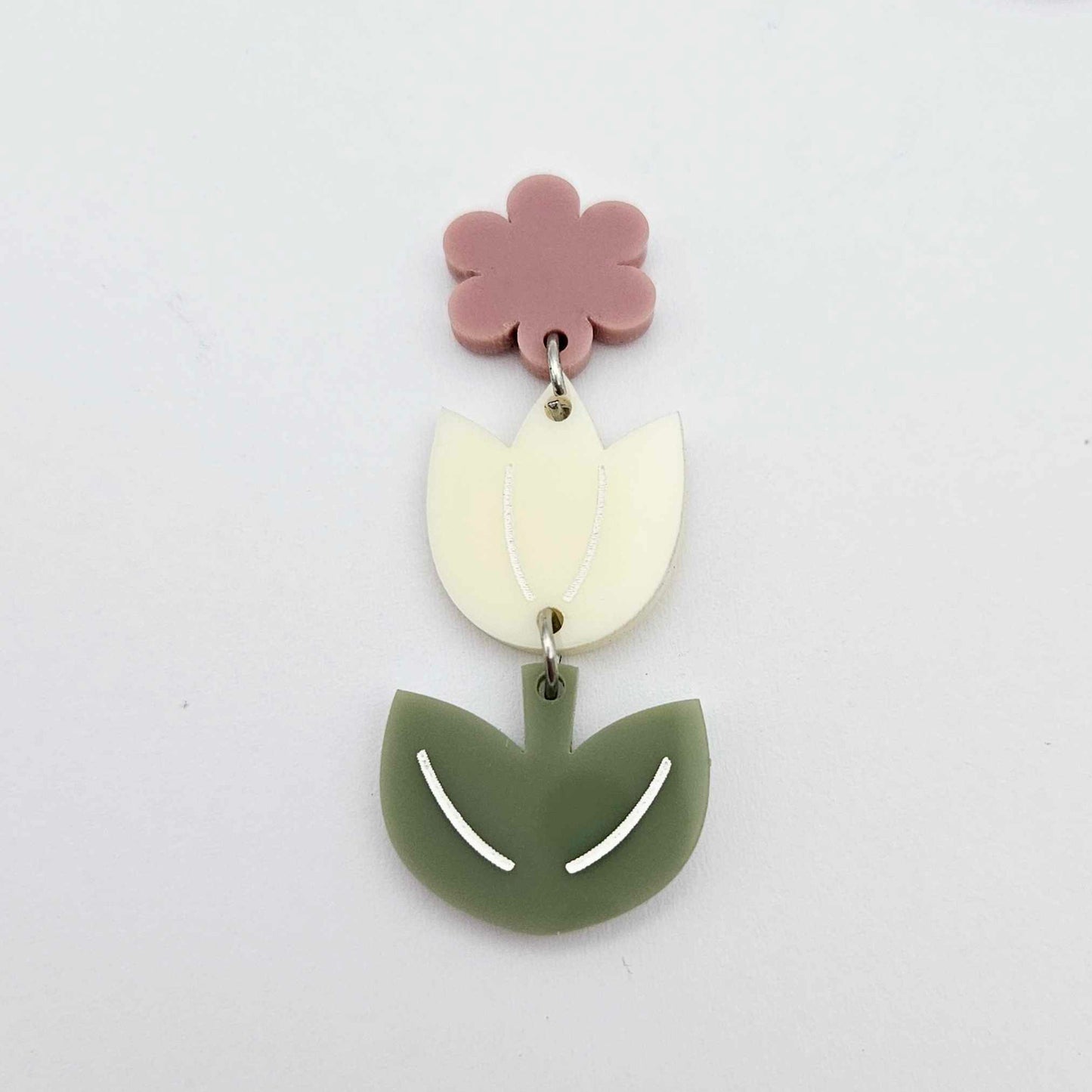 Assembled cream and olive green acrylic tulip dangle hanging from a 14mm flower topper, engraved detail paint filled white
