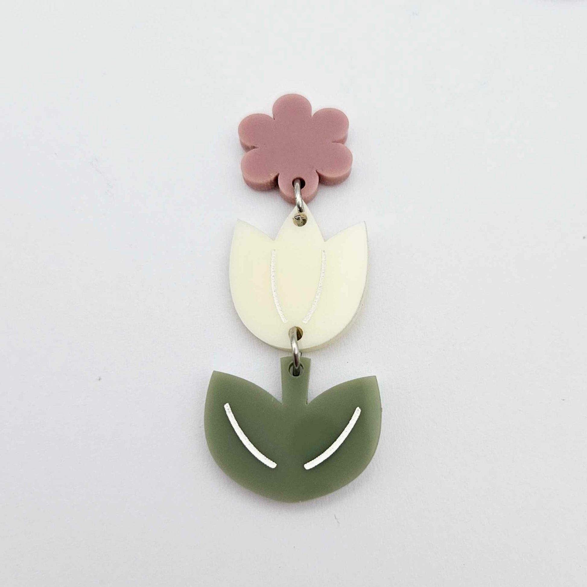 Assembled cream and olive green acrylic tulip dangle hanging from a 14mm flower topper, engraved detail paint filled white