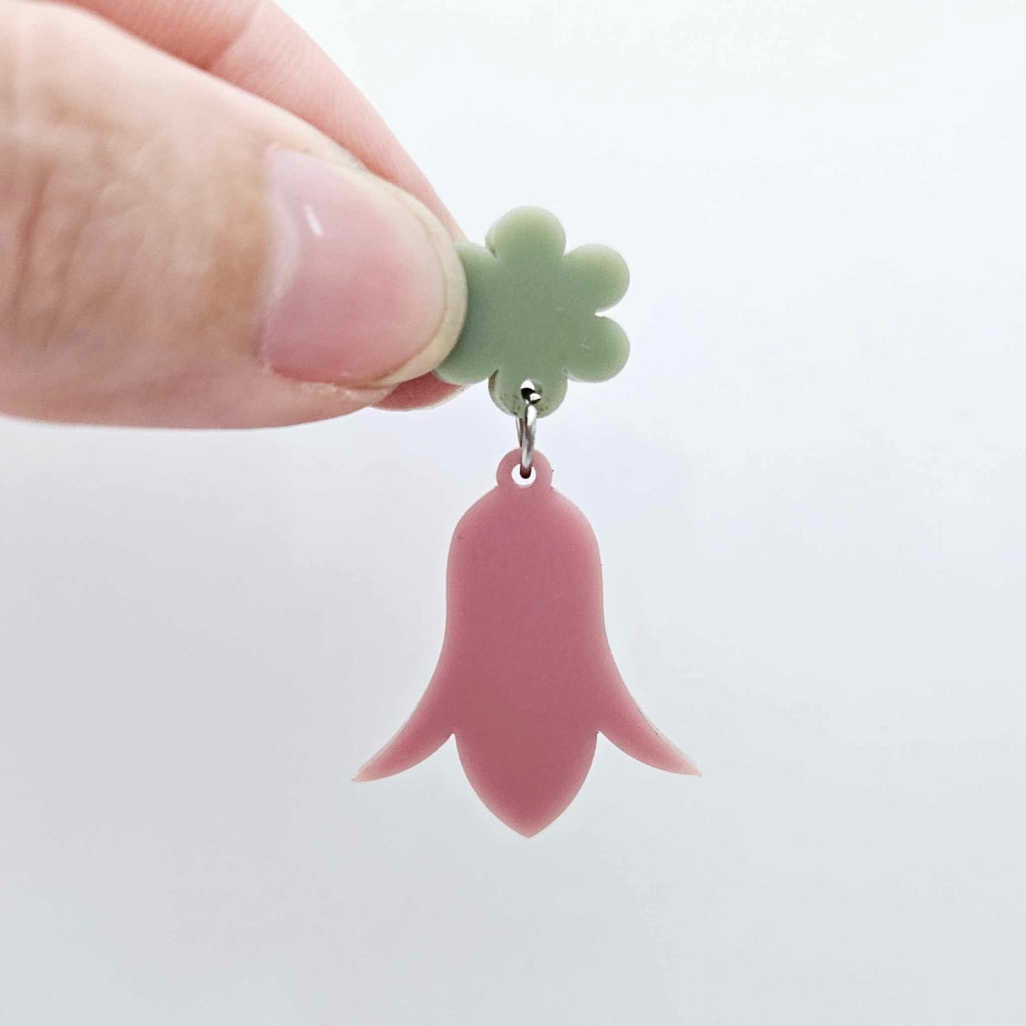 28mm dusty rose acrylic nodding flower dangle hanging from a 14mm flower topper, shown as a completed earring design
