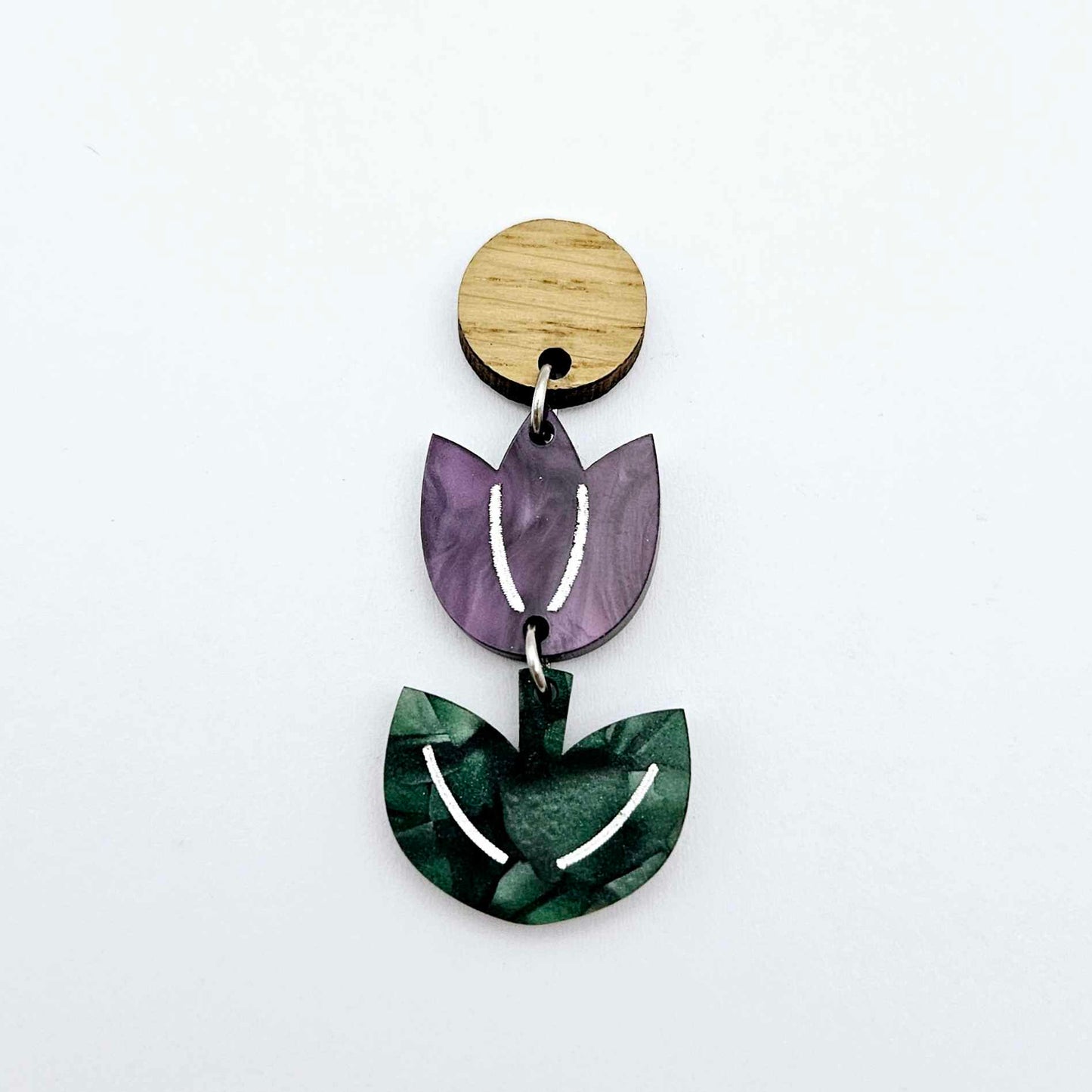 Assembled purple marble and green mineral acrylic tulip dangle hanging from a 14mm oak wood topper, engraved detail paint filled white