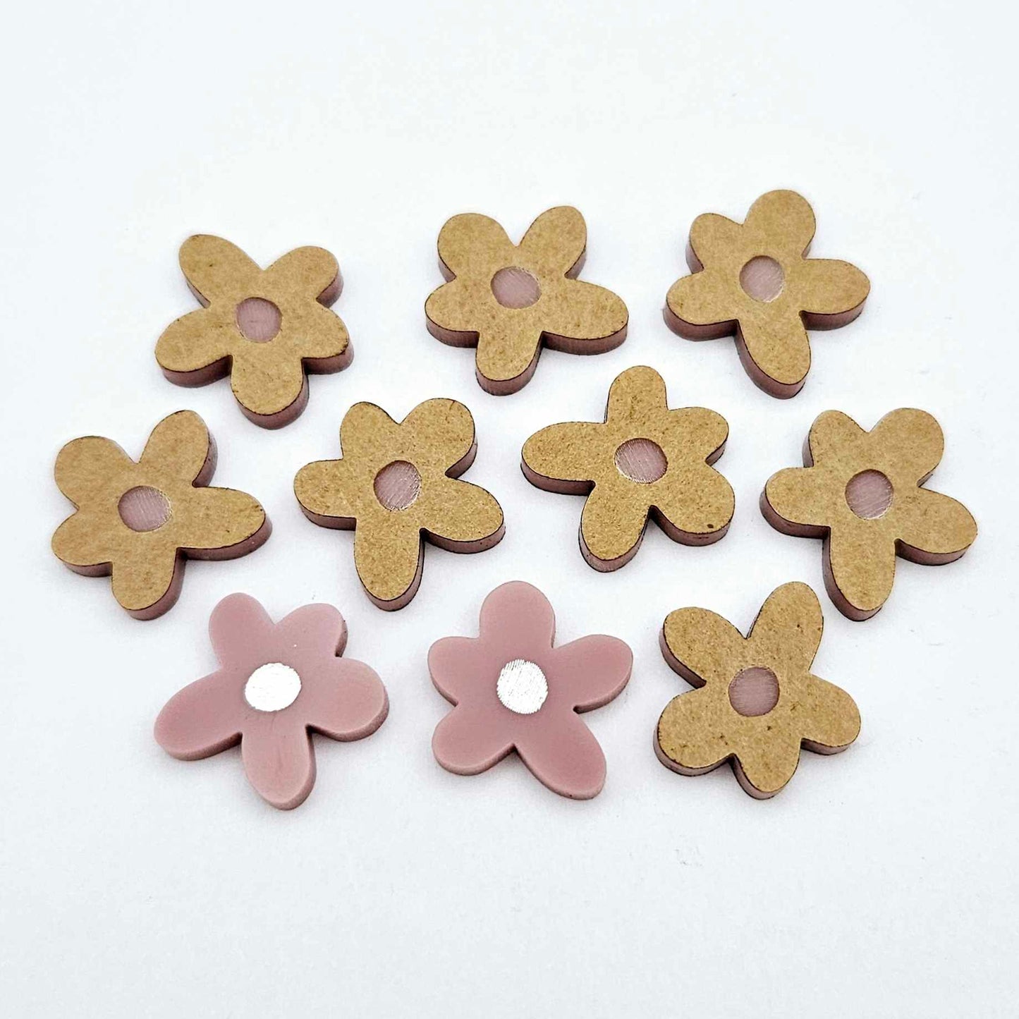 16mm dusty rose organic flower stud blanks with engraved centre, one pair paint filled white and several unfilled pieces shown with protective film on