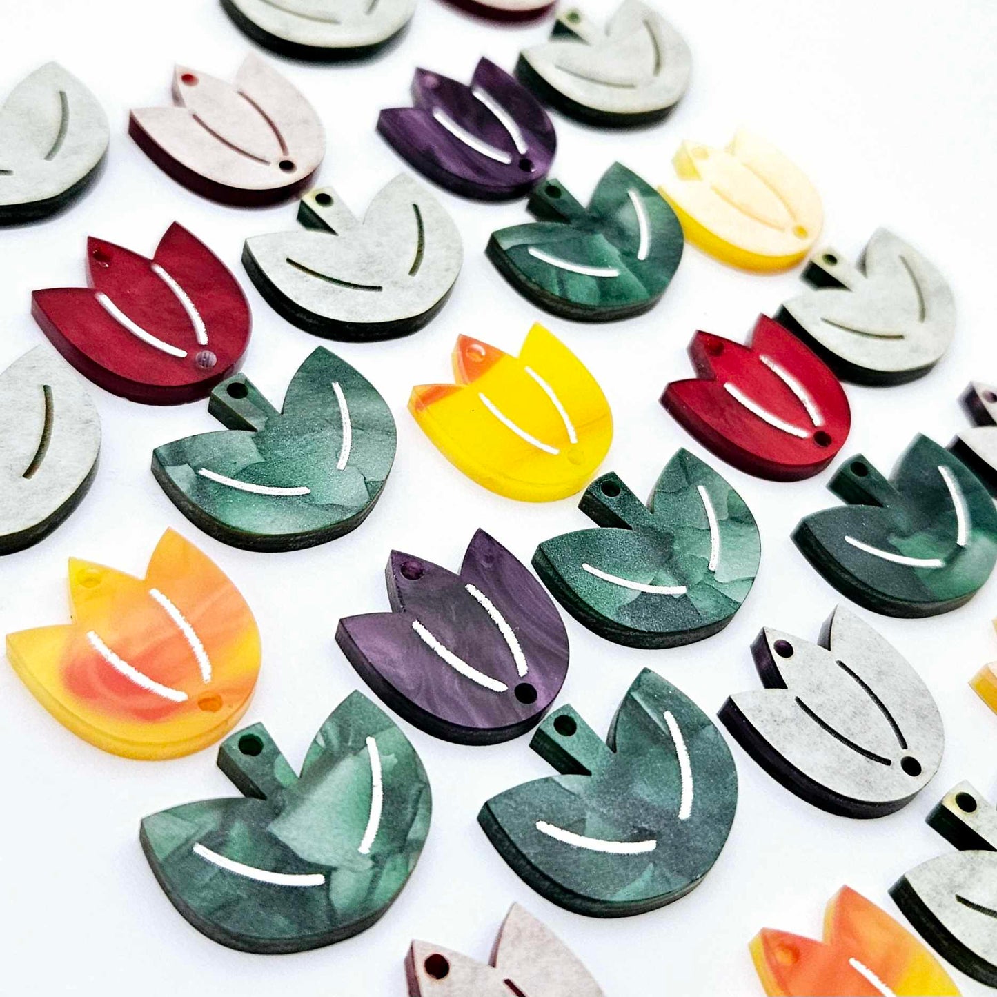 Two-piece tulip acrylic dangle blanks in marble and green mineral acrylic mixed pack, paint filled white on some with remaining unfilled