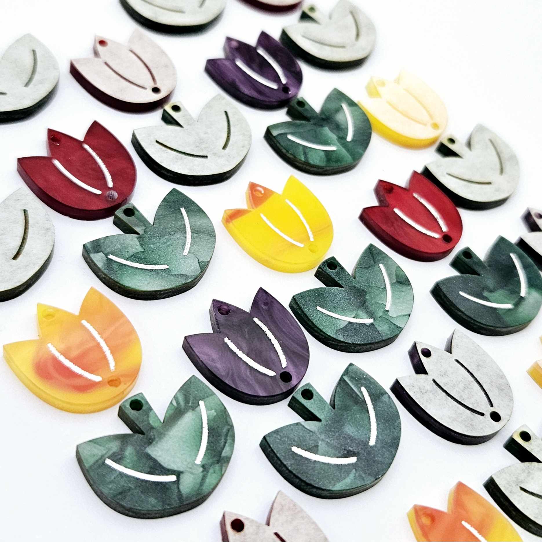 Two-piece tulip acrylic dangle blanks in marble and green mineral acrylic mixed pack, paint filled white on some with remaining unfilled