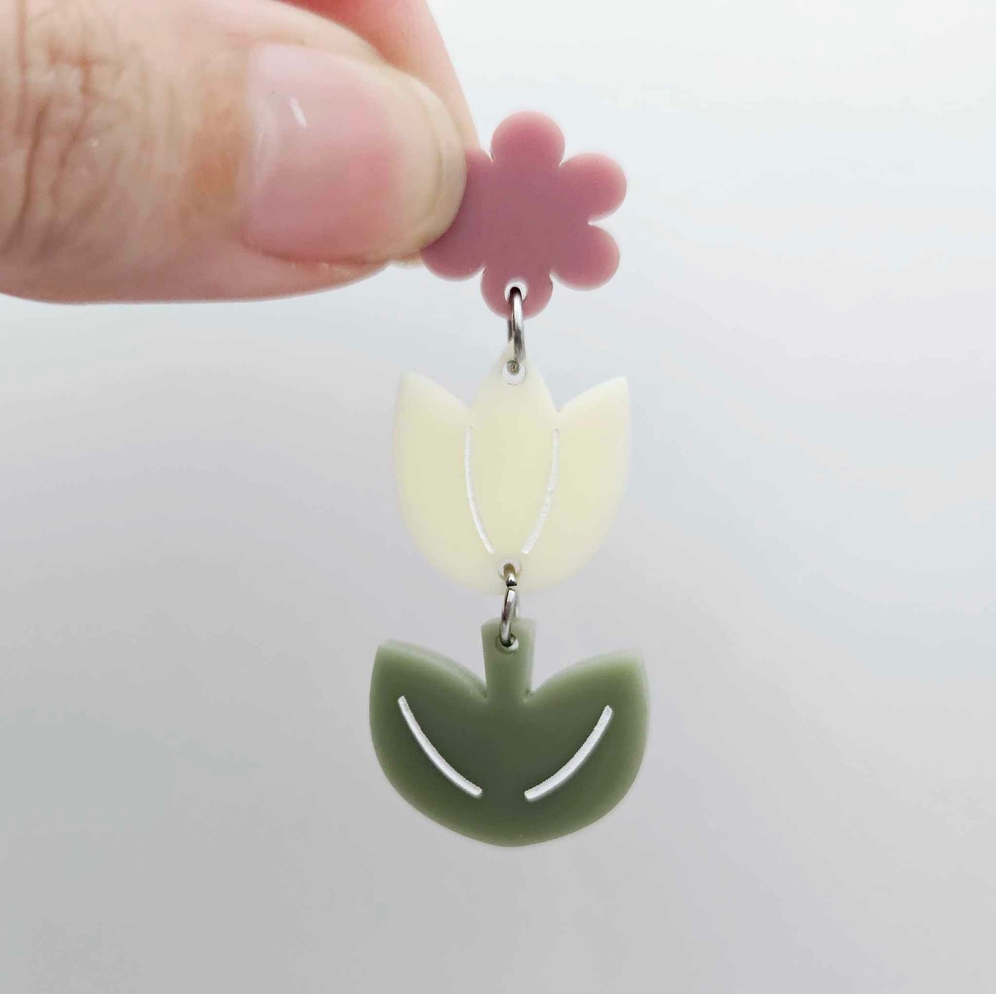 Assembled cream and olive green acrylic tulip dangle hanging from a 14mm flower topper, engraved detail paint filled white