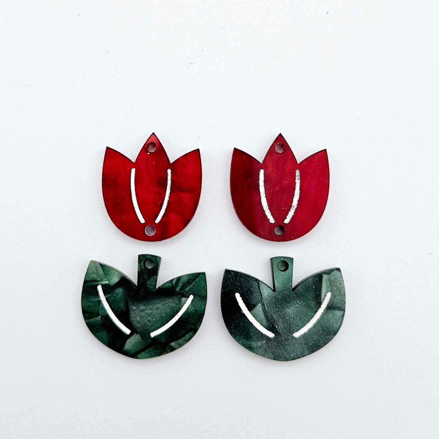 Two-piece tulip acrylic dangle blanks in red marble and green mineral acrylic, paint filled white on one pair