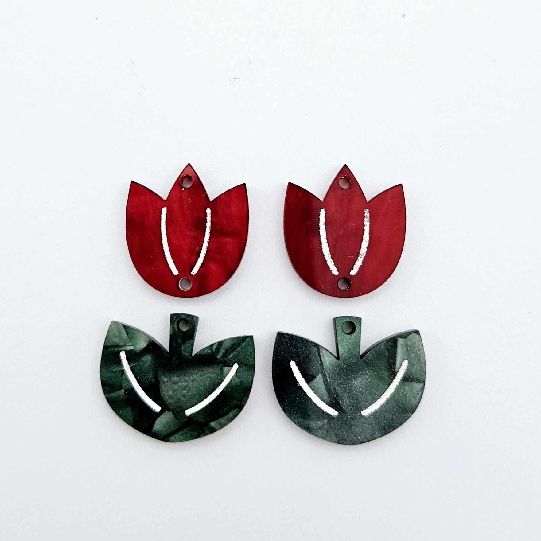 Two-piece tulip acrylic dangle blanks in red marble and green mineral acrylic, paint filled white on one pair