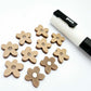 16mm iced coffee brown organic flower stud blanks showing paint filled white example and unfilled pieces with protective film, pictured with a white Posca paint pen