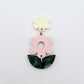 Assembled strawberry milkshake and green mineral acrylic flower dangle hanging from a cream flower topper, layered botanical earring design