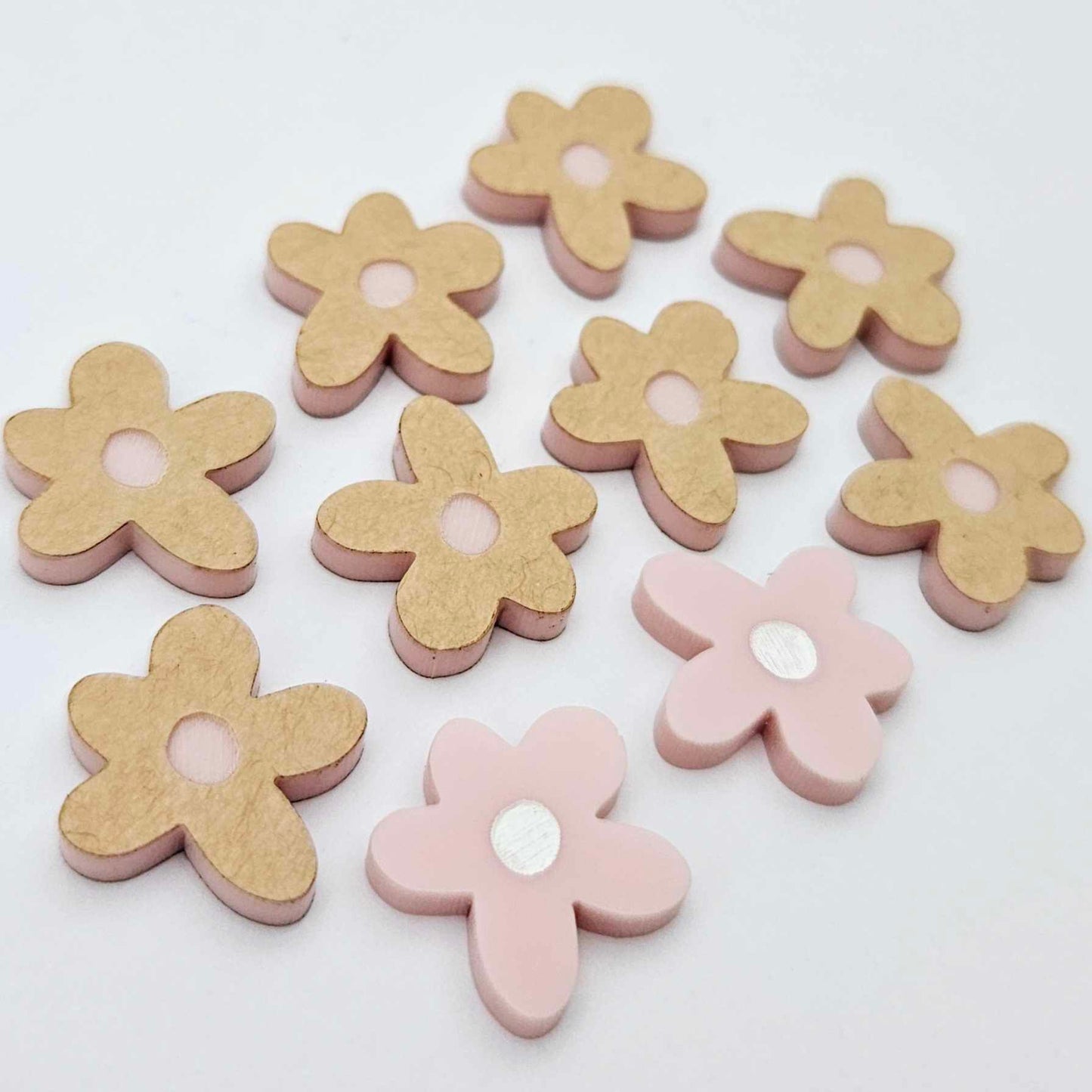 16mm dusty pale pink organic flower stud blanks with engraved centre, one pair paint filled white and several unfilled pieces shown with protective film on