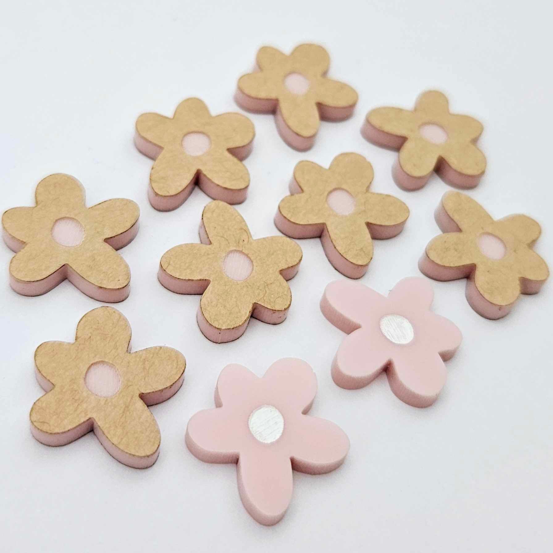 16mm dusty pale pink organic flower stud blanks with engraved centre, one pair paint filled white and several unfilled pieces shown with protective film on