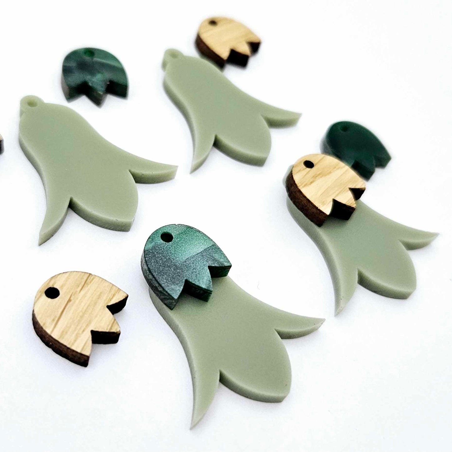 28mm olive green acrylic nodding flower dangle blanks shown on their own and with oak wood and green mineral leaf cap pieces