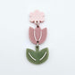 Assembled dusty rose and olive green tulip dangle hanging from a 14mm flower topper, engraved detail paint filled white