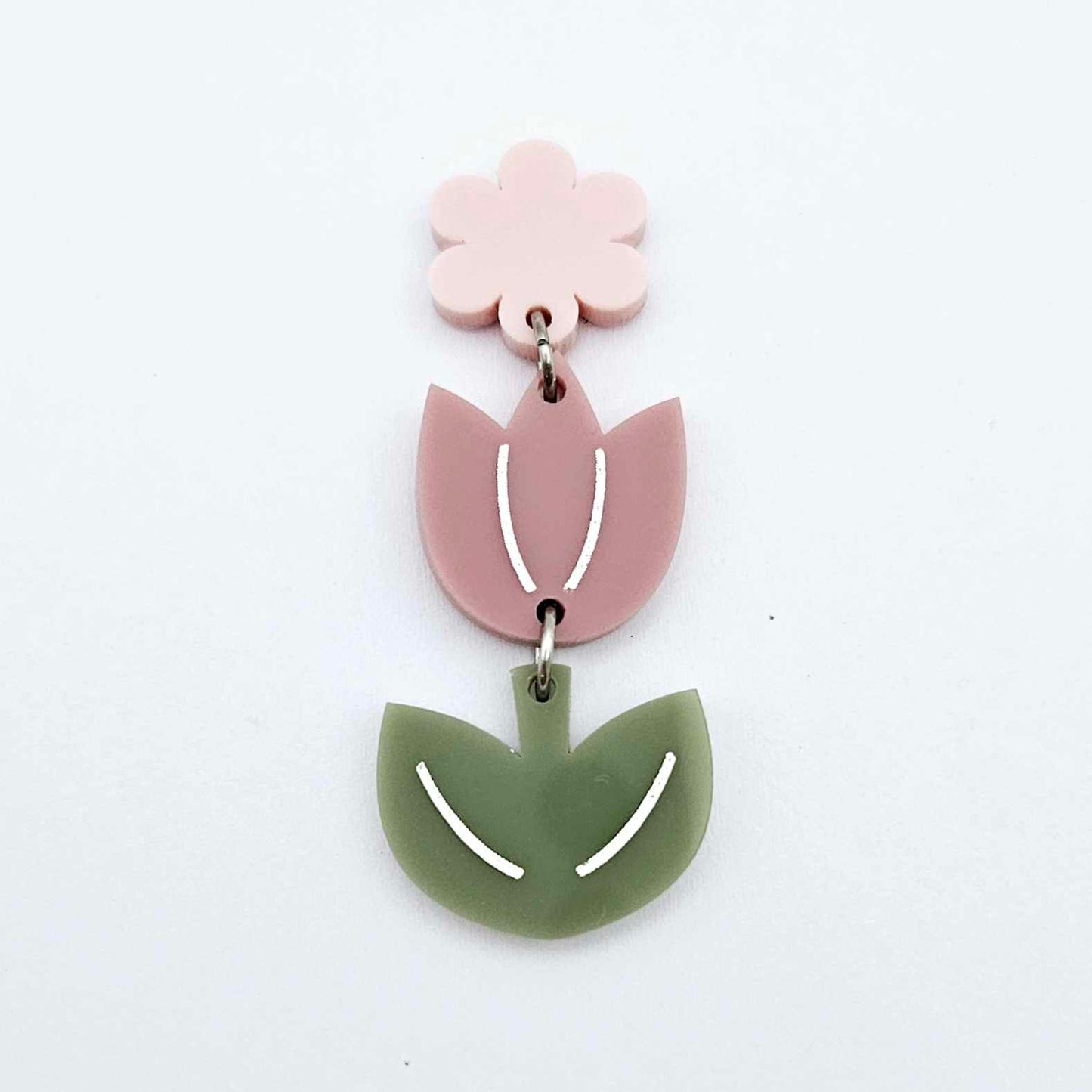 Assembled dusty rose and olive green tulip dangle hanging from a 14mm flower topper, engraved detail paint filled white