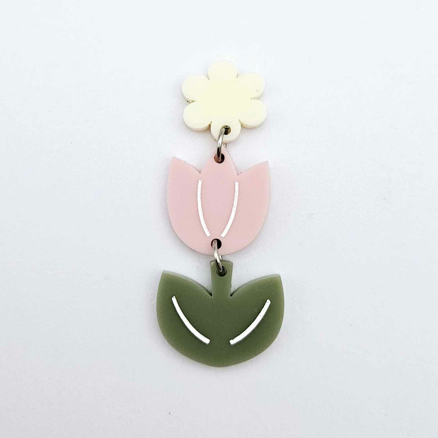 Assembled dusty pale pink and olive green acrylic tulip dangle hanging from a 14mm flower topper, engraved detail paint filled white