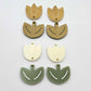 Cream and olive green acrylic tulip dangle blanks, one pair paint filled white and one pair with protective paper on, shown as a two-piece floral design