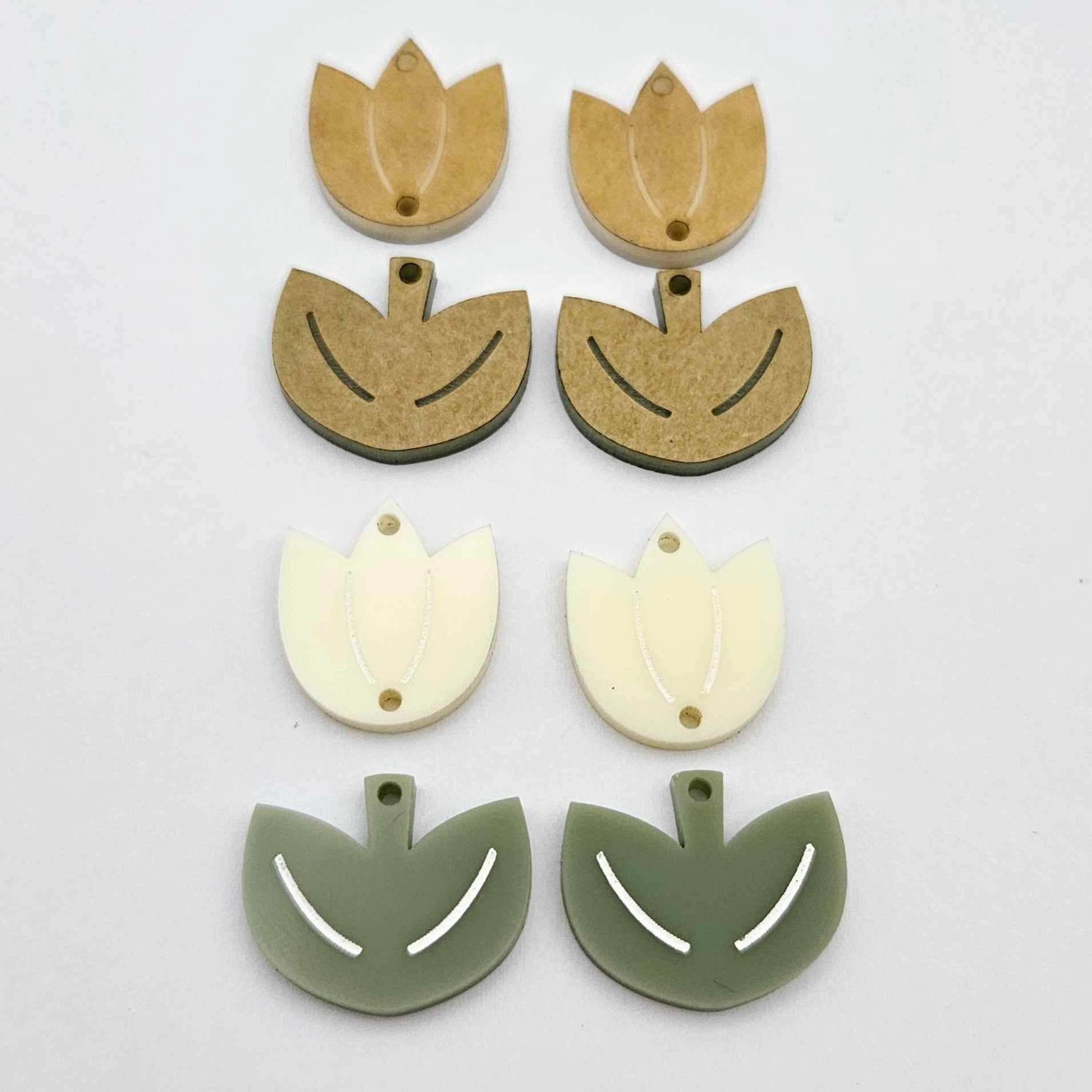 Cream and olive green acrylic tulip dangle blanks, one pair paint filled white and one pair with protective paper on, shown as a two-piece floral design