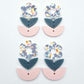 Three-piece acrylic flower dangle blanks shown unassembled laying flat, featuring Hawaii Dream UV printed flower, bluestone leafy middle and strawberry milkshake leafy bottom