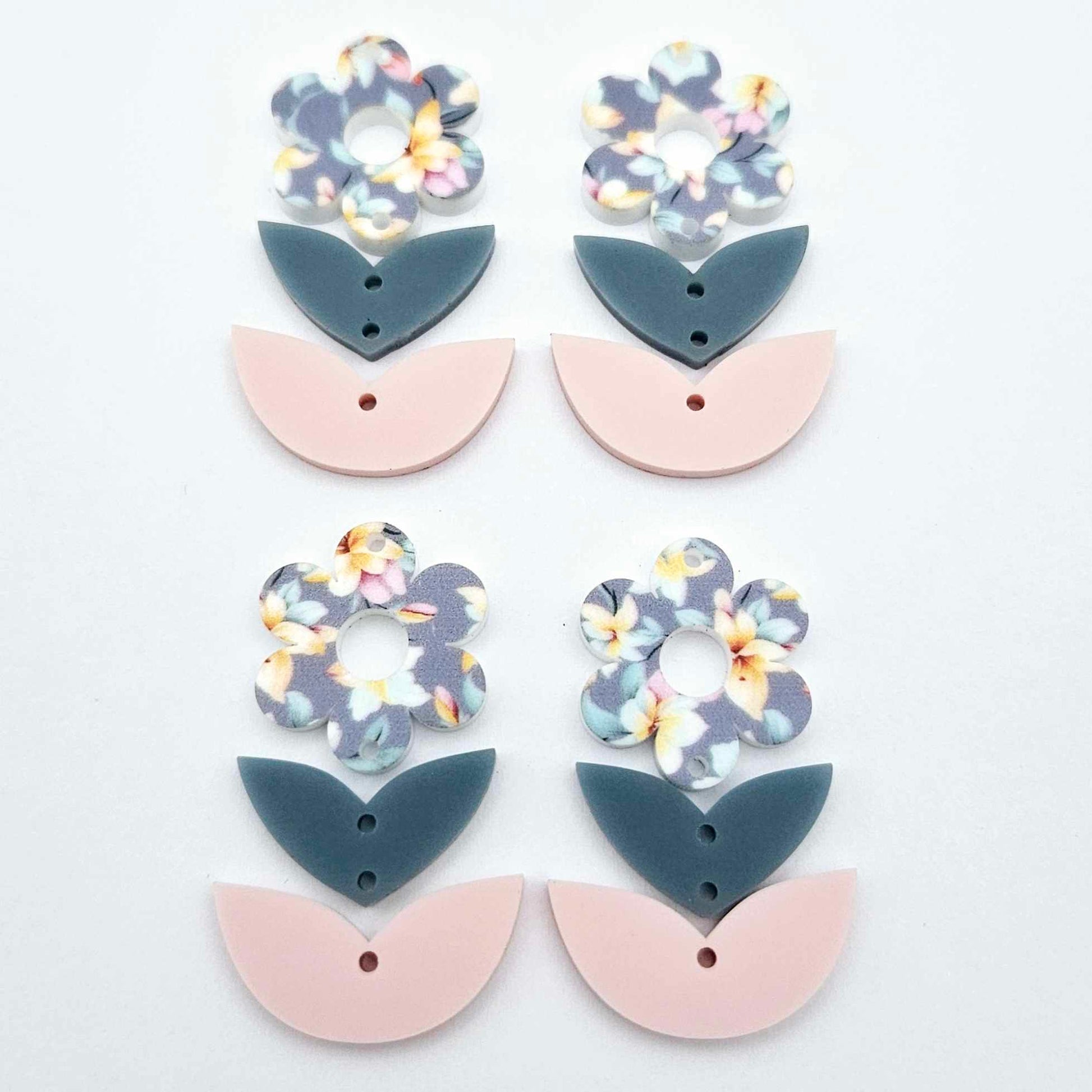 Three-piece acrylic flower dangle blanks shown unassembled laying flat, featuring Hawaii Dream UV printed flower, bluestone leafy middle and strawberry milkshake leafy bottom