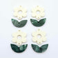 Two-piece cream flower and green mineral leafy dangle blanks shown unassembled and laying flat to display the full 31mm floral design