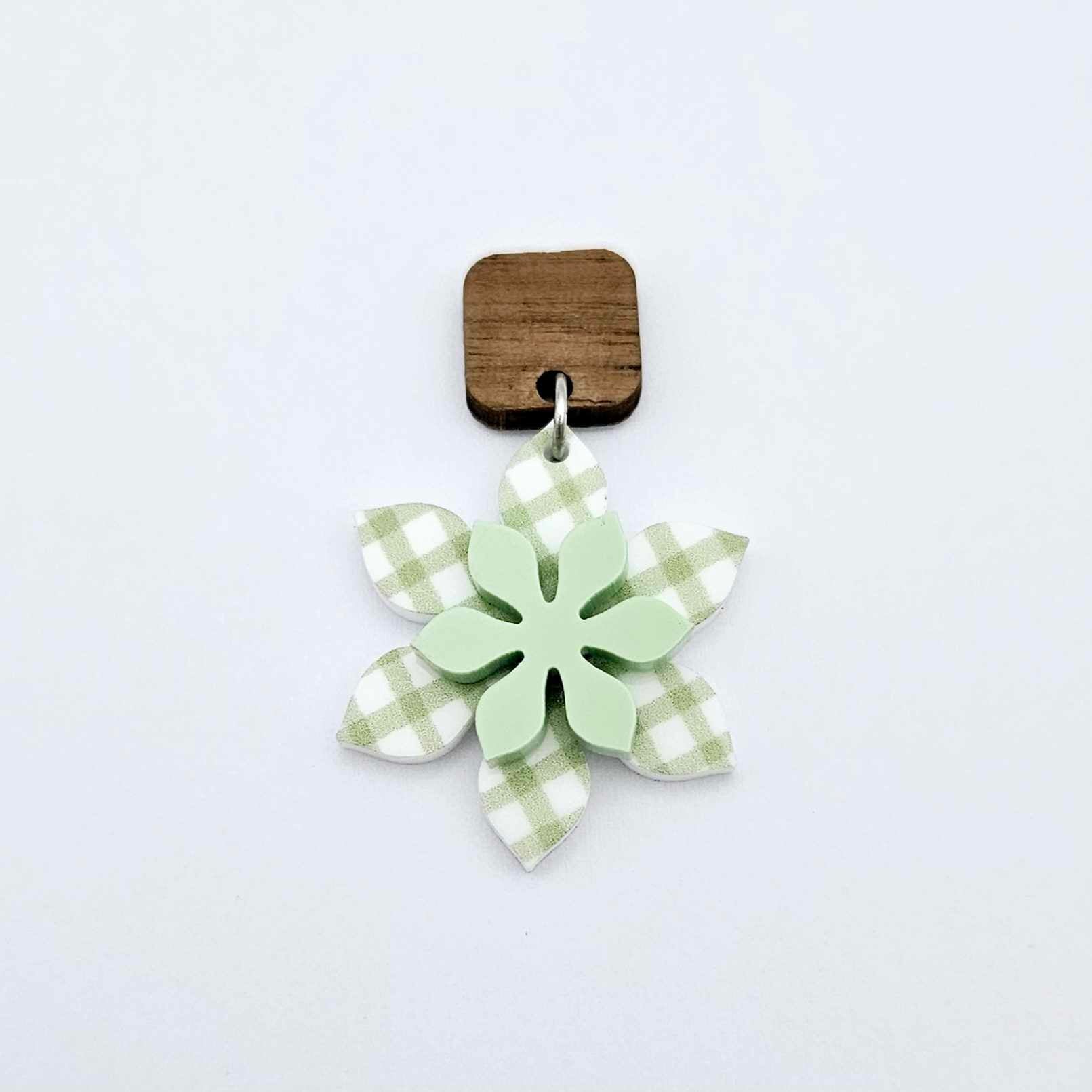 Layered green gingham UV print and pastel green acrylic flower dangle assembled and hanging from a 12mm walnut wood topper, 3D two tone floral design