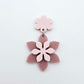 Layered dusty rose and strawberry milkshake flower dangle assembled and hanging from a strawberry milkshake flower topper, 3D two tone floral design