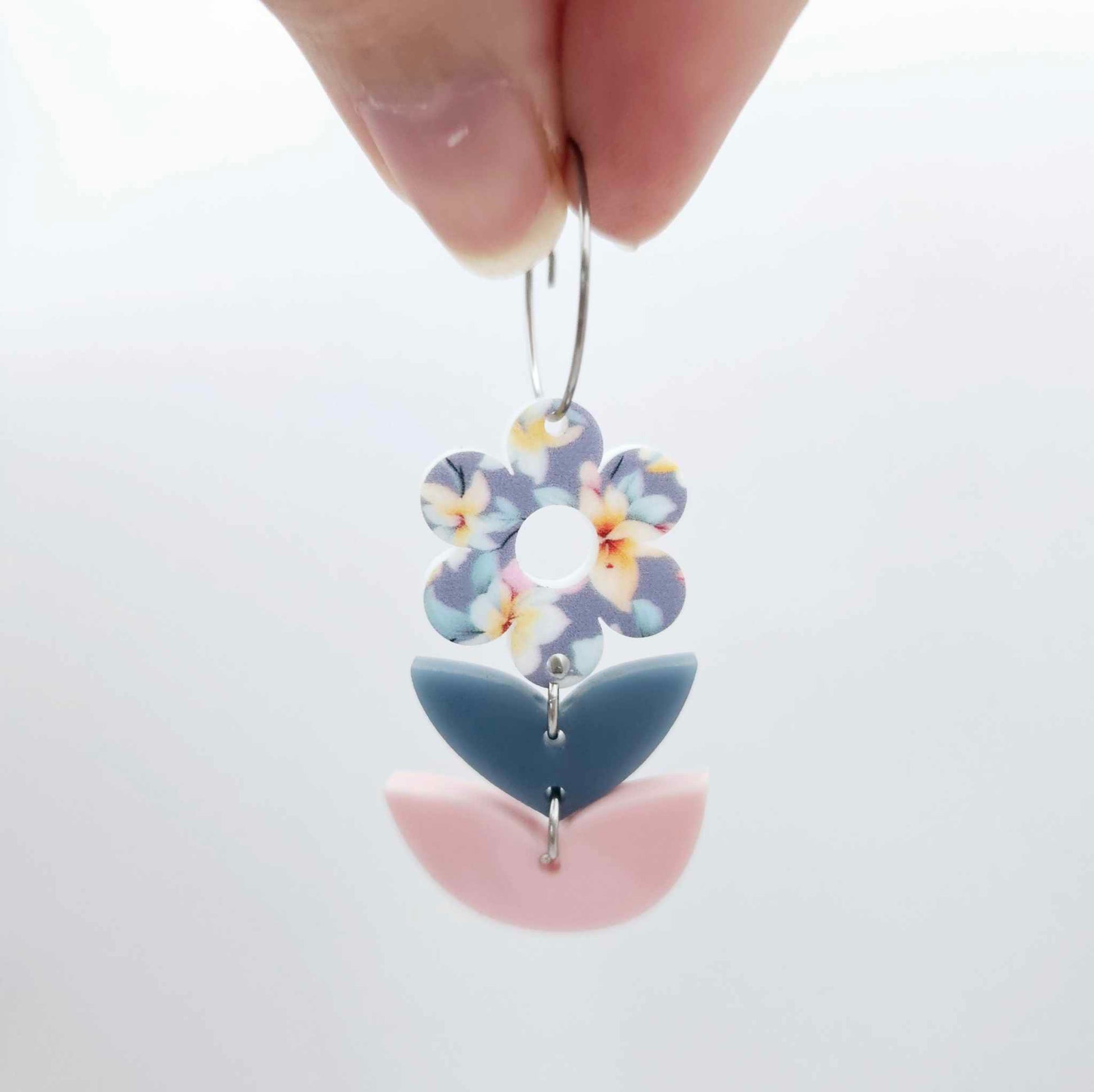 Assembled three-piece acrylic flower dangle hanging from a 20mm hoop, UV printed Hawaii Dream flower with bluestone and strawberry milkshake leaf layers