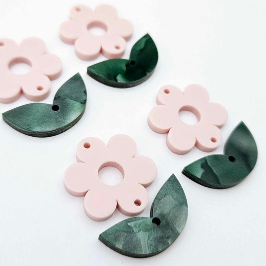 Two-piece Strawberry Milkshake pink flower and green mineral acrylic leafy dangle blanks shown unassembled and laying flat to display the full 31mm floral design