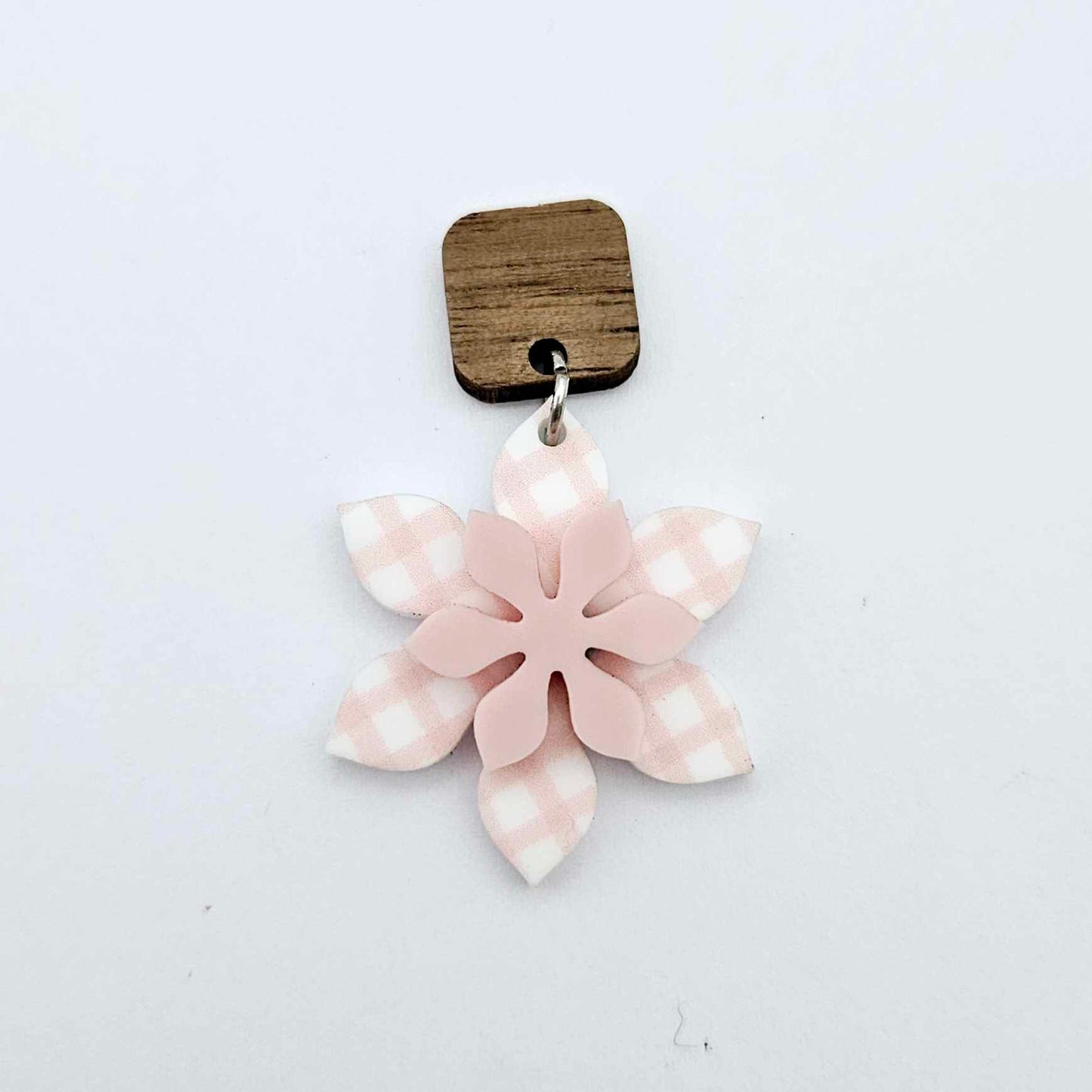 Layered pink gingham UV print and strawberry milkshake pink acrylic flower dangle assembled and hanging from a 12mm walnut wood topper, 3D two tone floral design