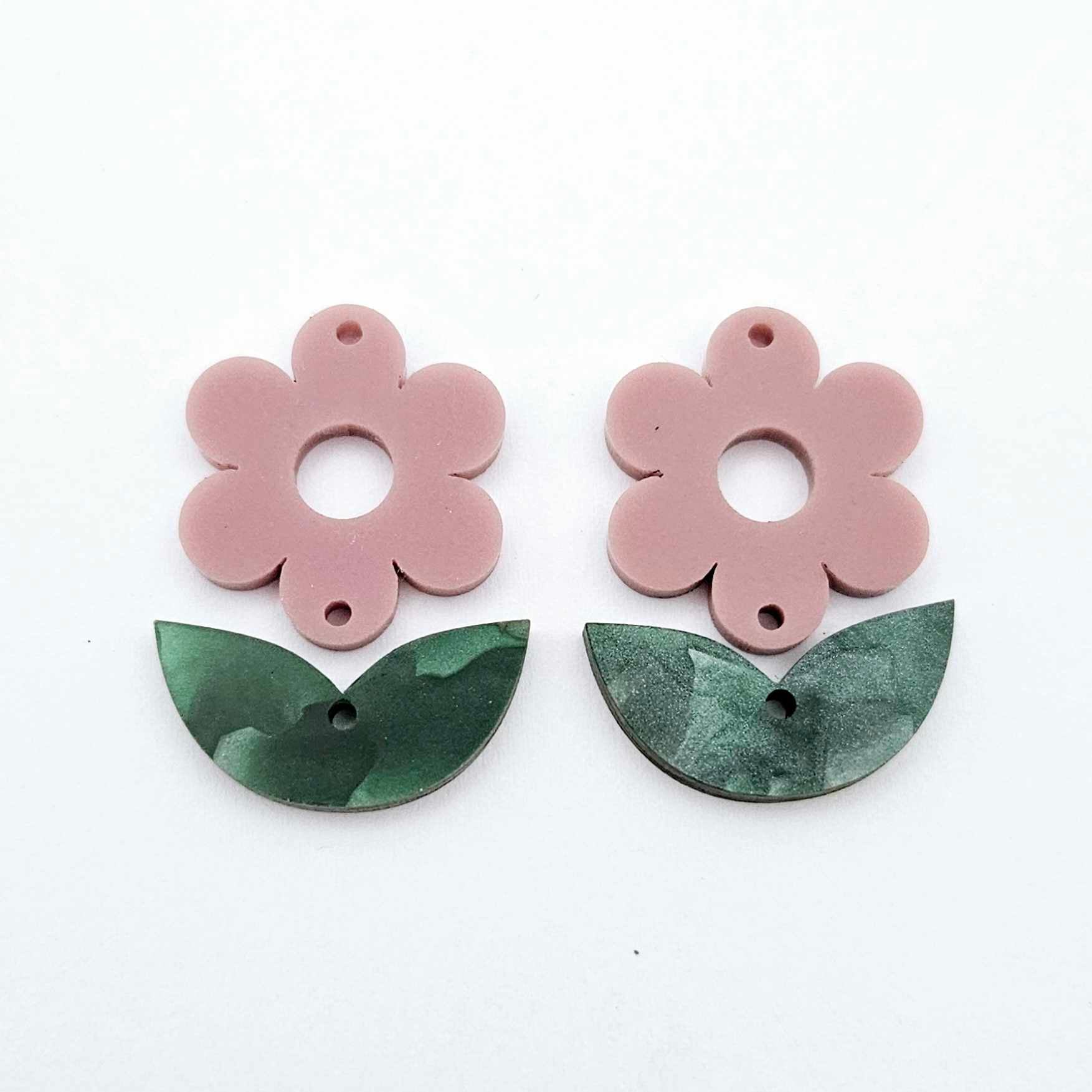 Two-piece dusty rose flower and green mineral acrylic leafy dangle blanks shown unassembled and laying flat to display the full 31mm floral design