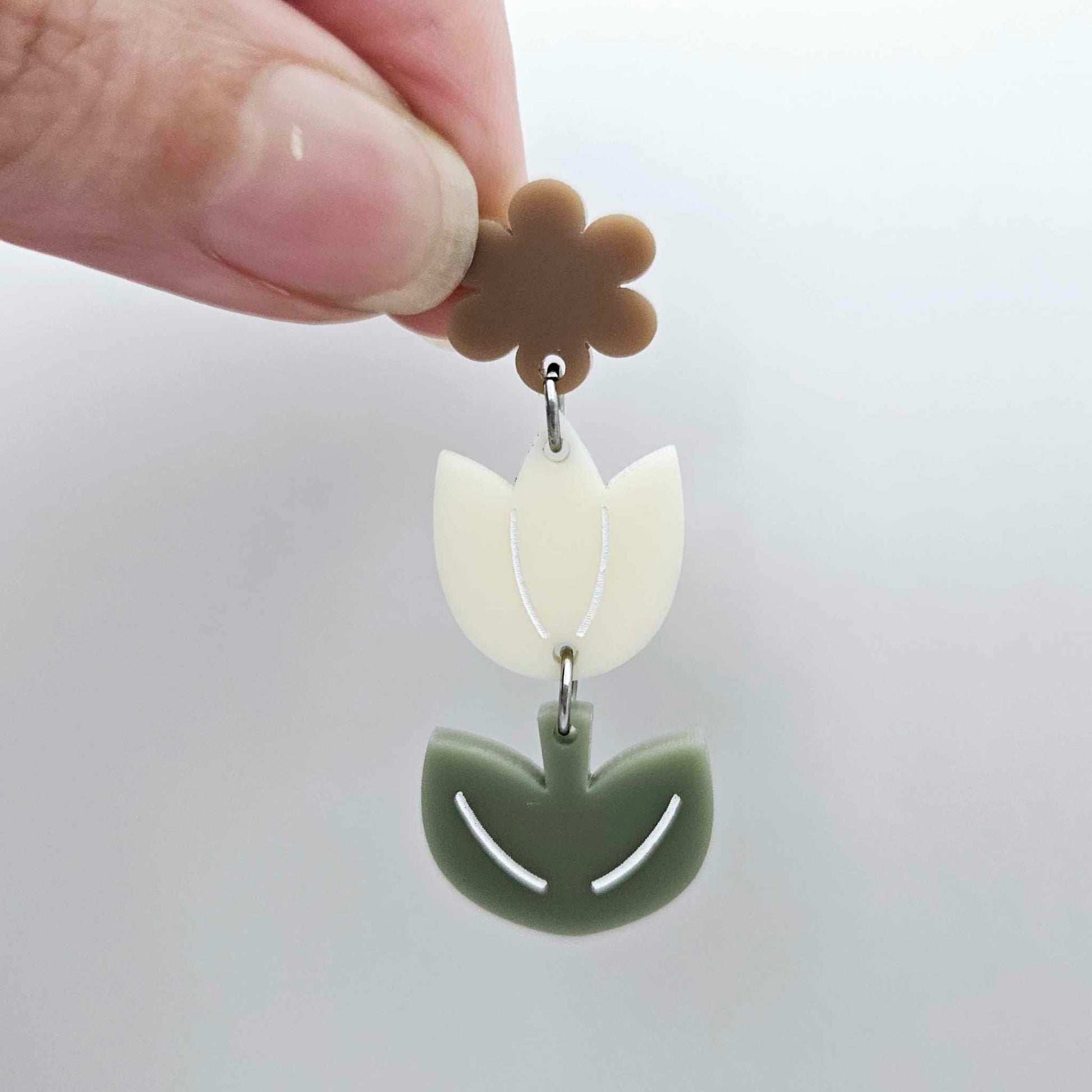 Cream and Olive Green acrylic tulip shape earring blanks shown with one of our iced coffee brown flower toppers