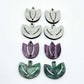 Two-piece tulip acrylic dangle blanks in purple marble and green mineral acrylic, paint filled white on one pair with remaining pair unfilled