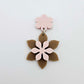 Layered iced coffee and strawberry milkshake flower dangle assembled and hanging from a strawberry milkshake flower topper, 3D two tone floral design